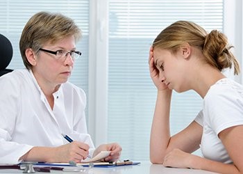 two women discussing addiction