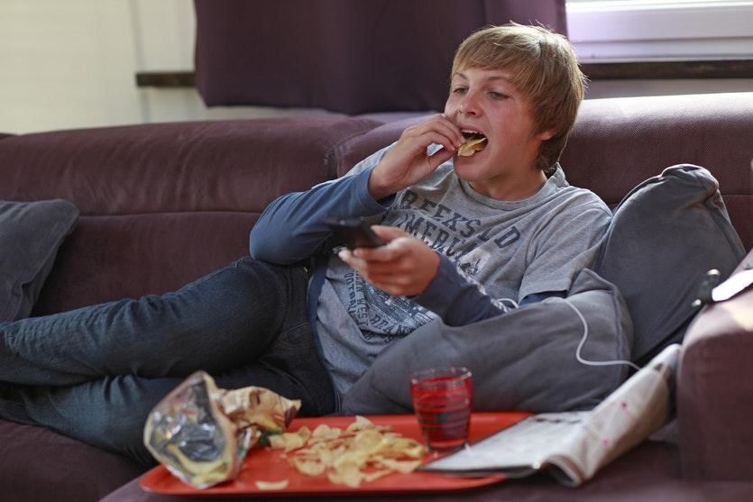 Image showing a boy overeating compulsively