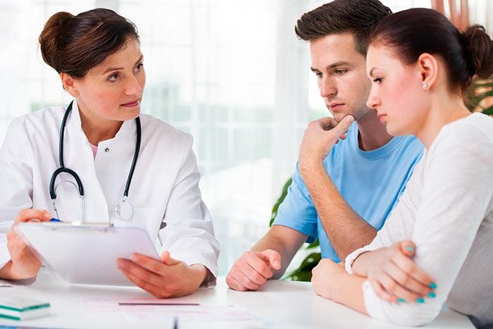 image showing a couple during consultation with a doctor