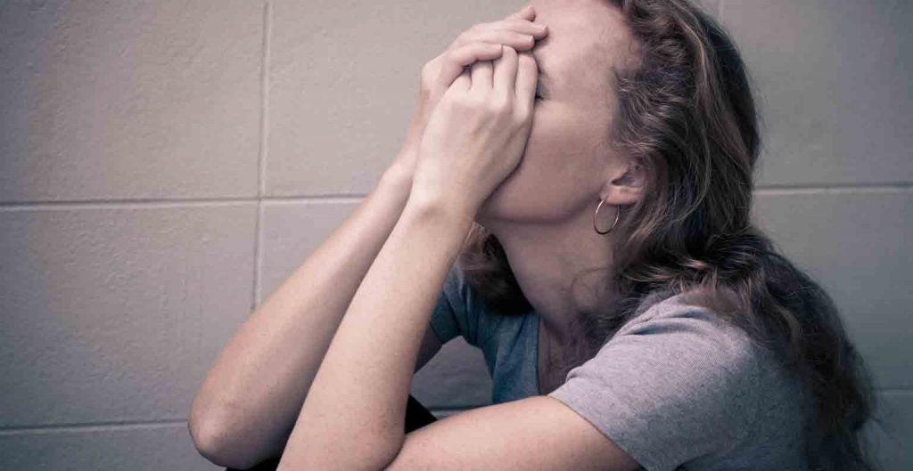 a woman in desperation because of addiction photo