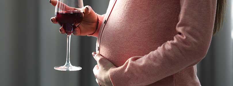 pregnant woman with wine glass