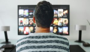 a photo of a man watching his pay per view screen